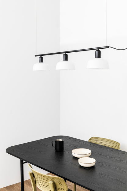 Faro Barcelona Tatawin medium 3 light linear pendant in white hanging over a dining table