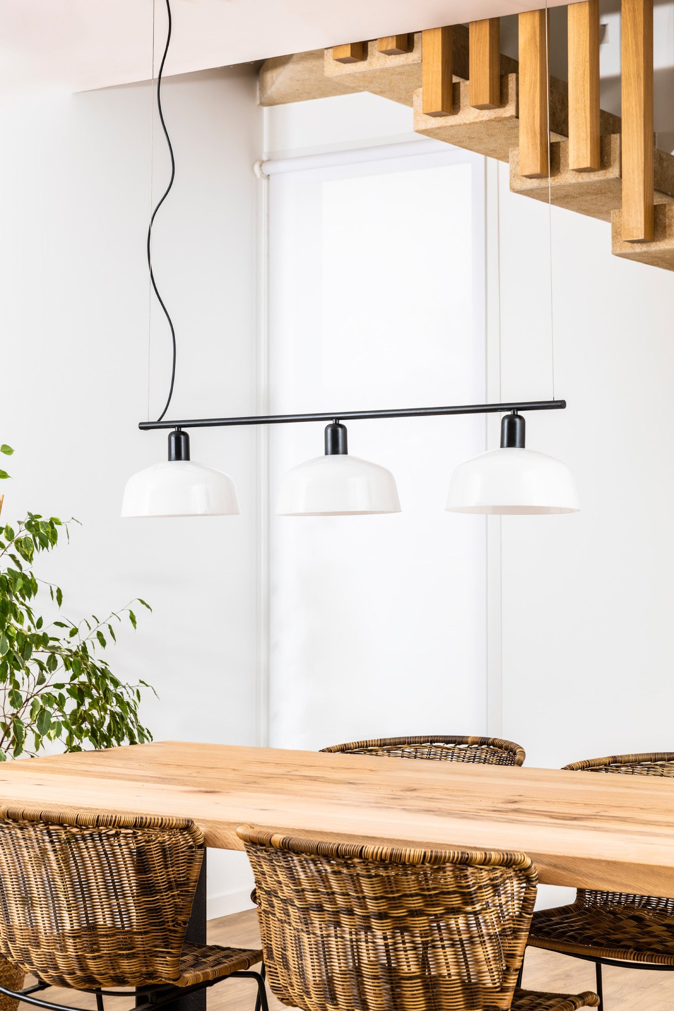 Faro Barcelona Tatawin medium 3 light linear pendant in White hanging over a dining table