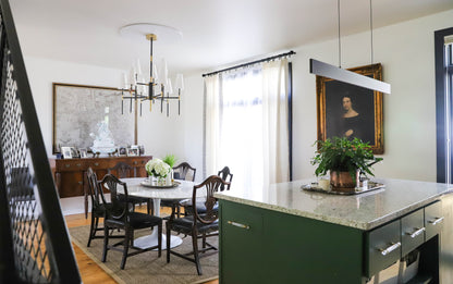 Hudson Valley Bowery 9 light chandelier in old bronze over dining table