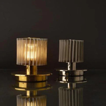 DCW Editions In The Sun Table Lamps with a Gold base and gold mesh shade and another with silver base and