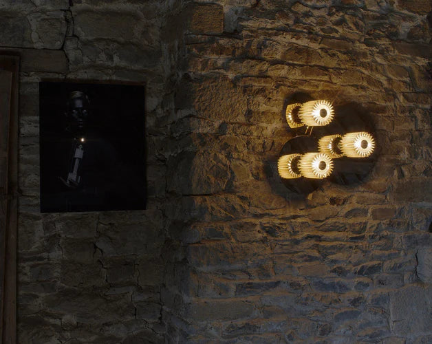 DCW Editions In The Sun Wall Light 3 sizes on brick wall