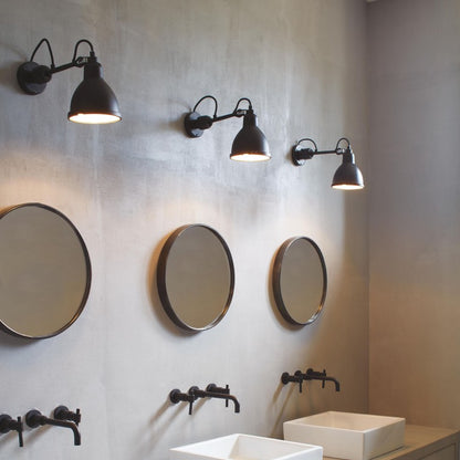 DCW Editions Lampe Gras No.304 bathroom in black over sinks